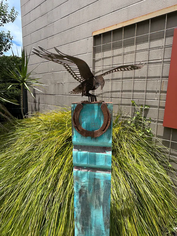 A totem with corten steel Kahu by Rustic Soul Sculptors available at The Little Gallery in Tairua