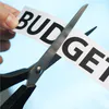 Budget cuts image of cutting text 'budget'